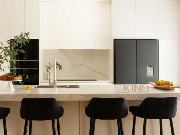 All-White Marble Vein Minimalist Galley Kitchen